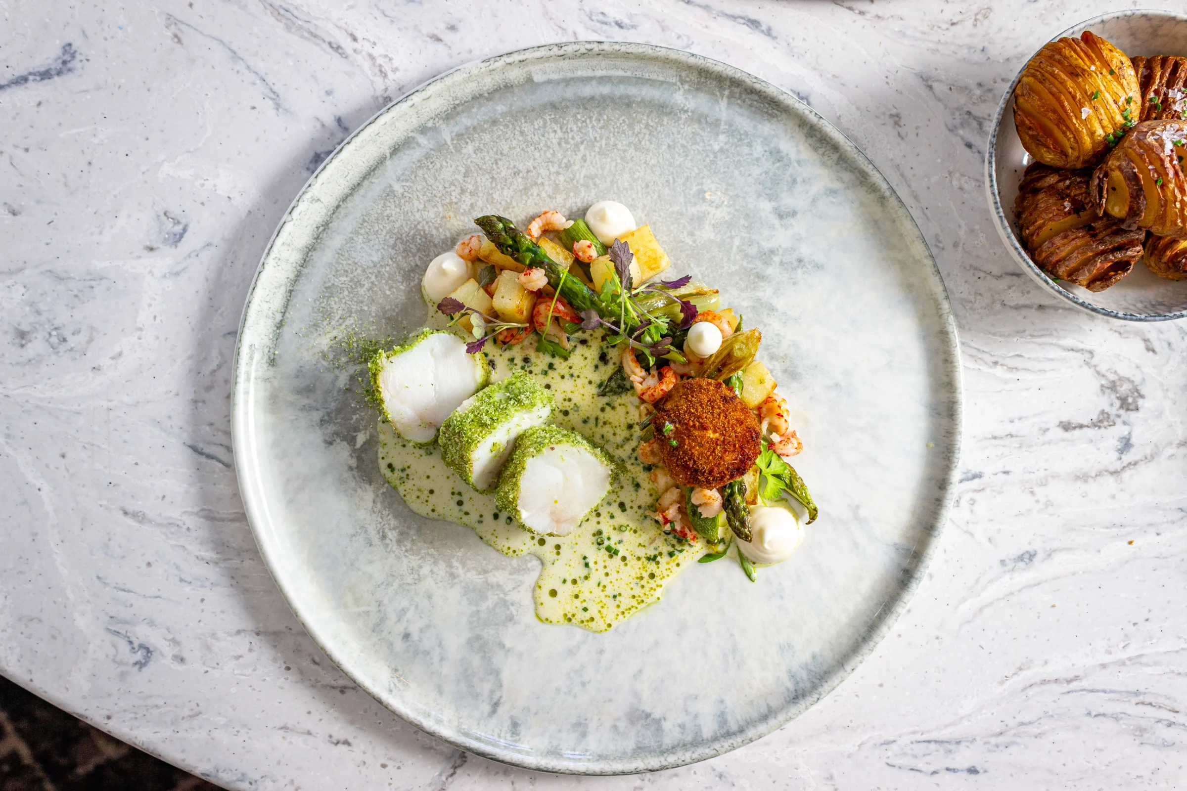 Fine dining cod, crayfish tails and asparagus dish at Bank House Hathersage