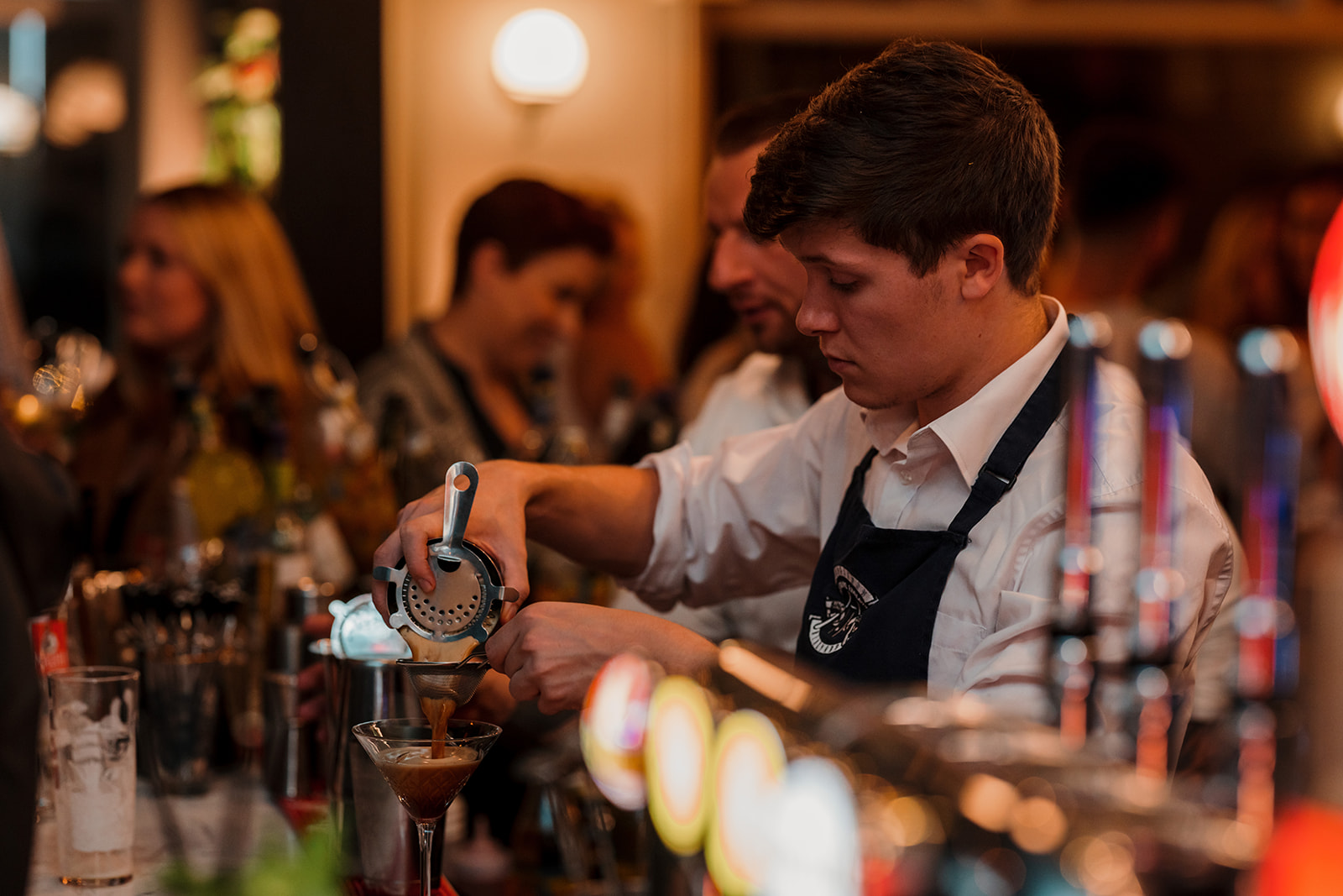 A member of the bar staff at work